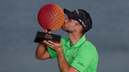 Daniel Gavins kisses the Ras Al Khaimah Championship trophy