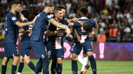 Kylian Mbappe (right) is cajoled by his PSG team-mates