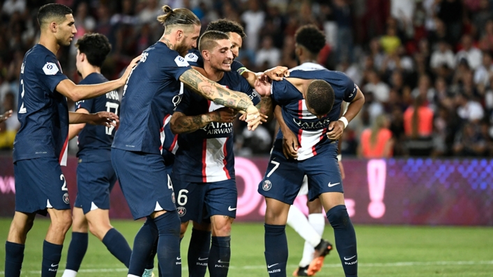 Kylian Mbappe (right) is cajoled by his PSG team-mates