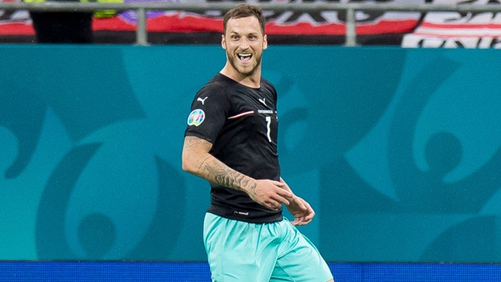 Marko Arnautovic celebrates after scoring for Austria against North Macedonia.