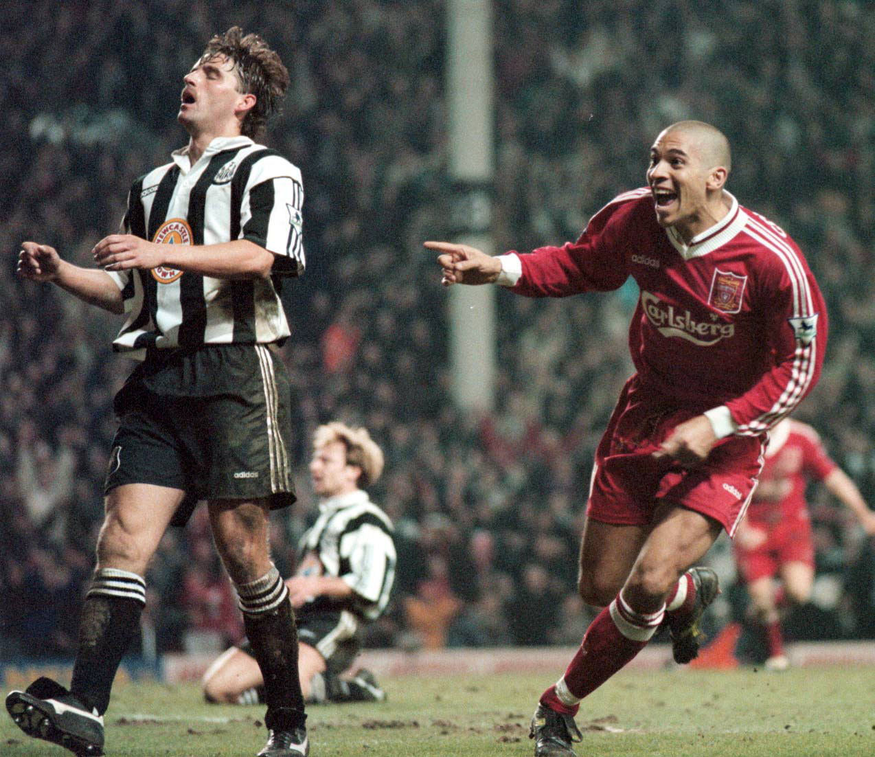 Stan Collymore turns away after scoring Liverpool's fourth