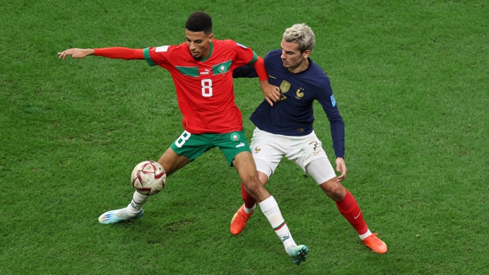 Azzedine Ounahi shields the ball from France's Antoine Griezmann at the World Cup