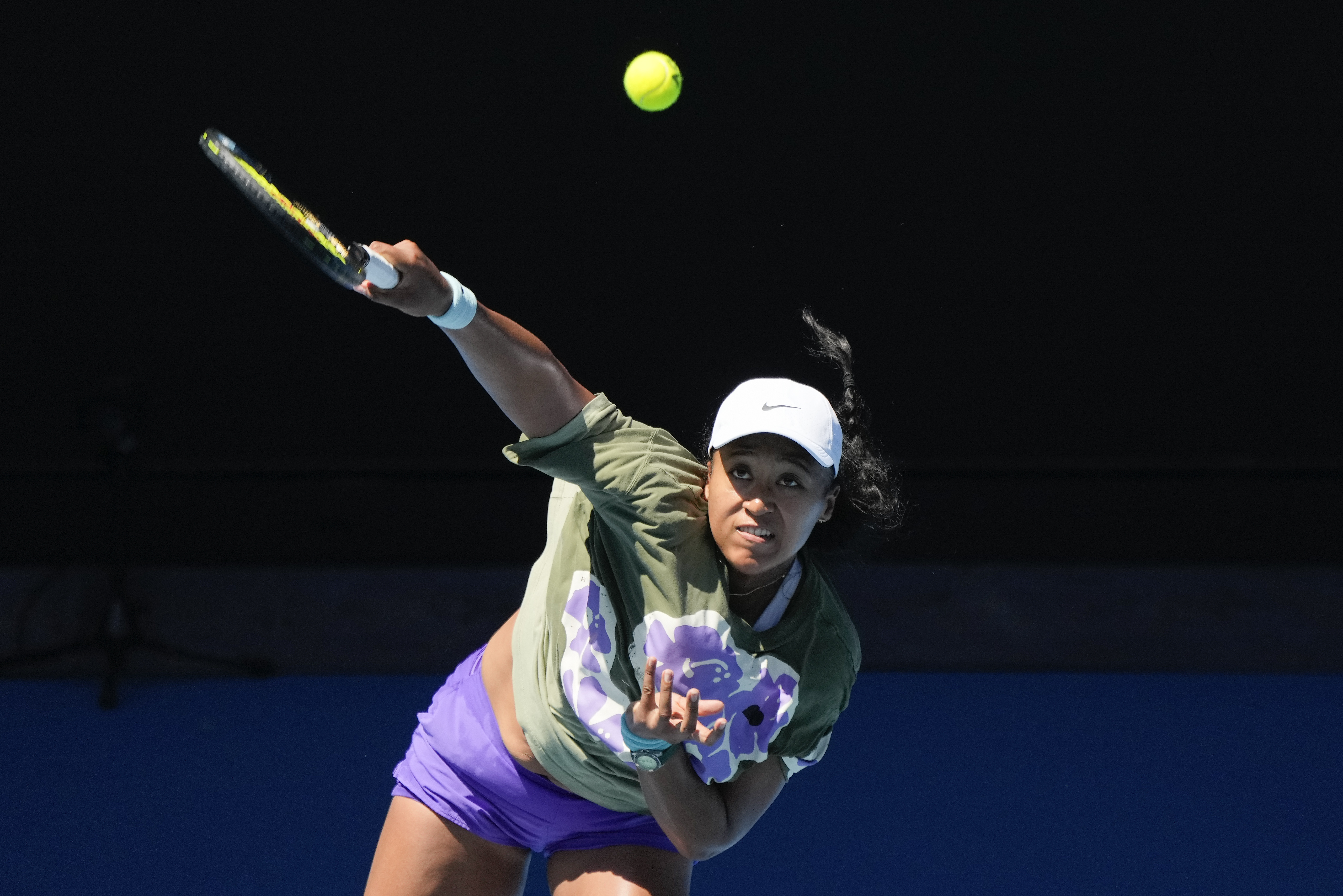 Naomi Osaka serves during a practice session in Melbourne