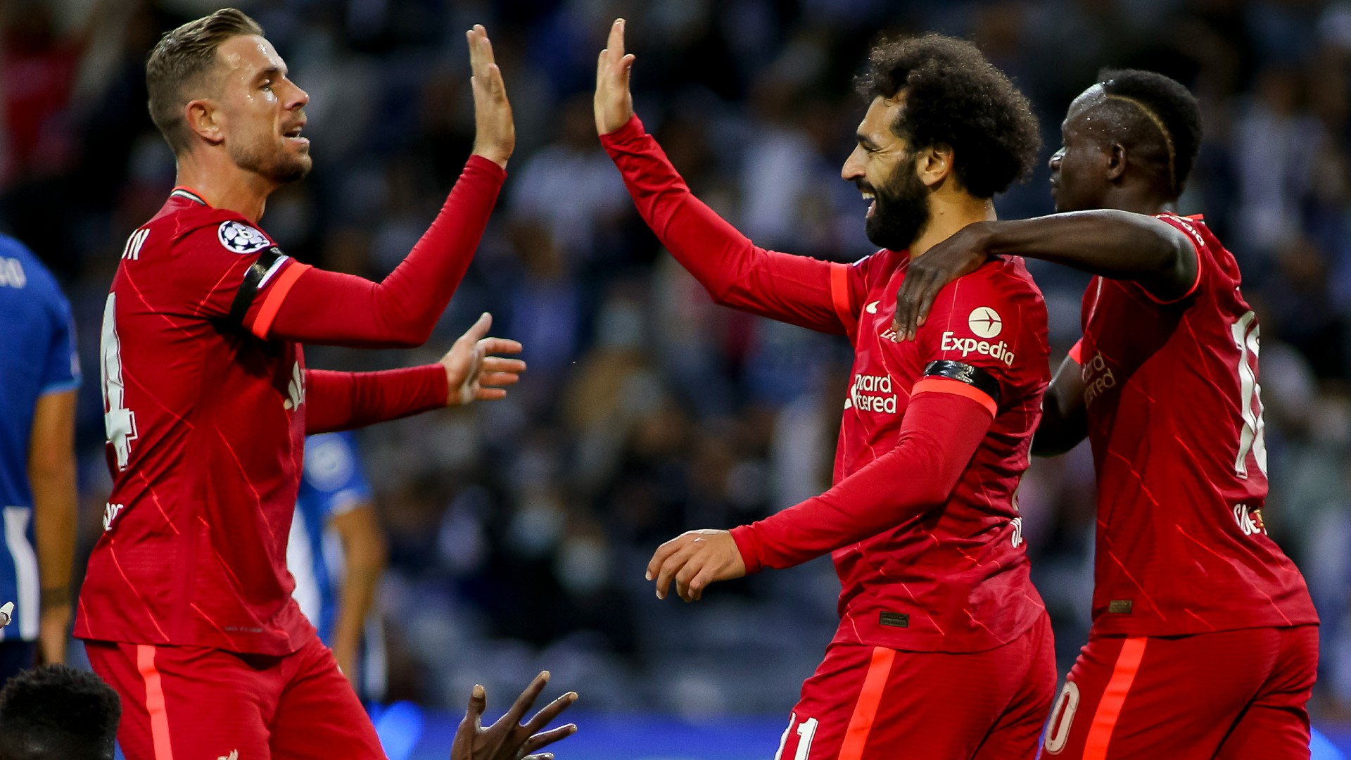 Mohamed Salah (centre) is congratulated after opening the scoring against Porto.