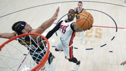 Miami Heat center Bam Adebayo is defended by Denver Nuggets forward Aaron Gordon (Mark J. Terrill/AP)