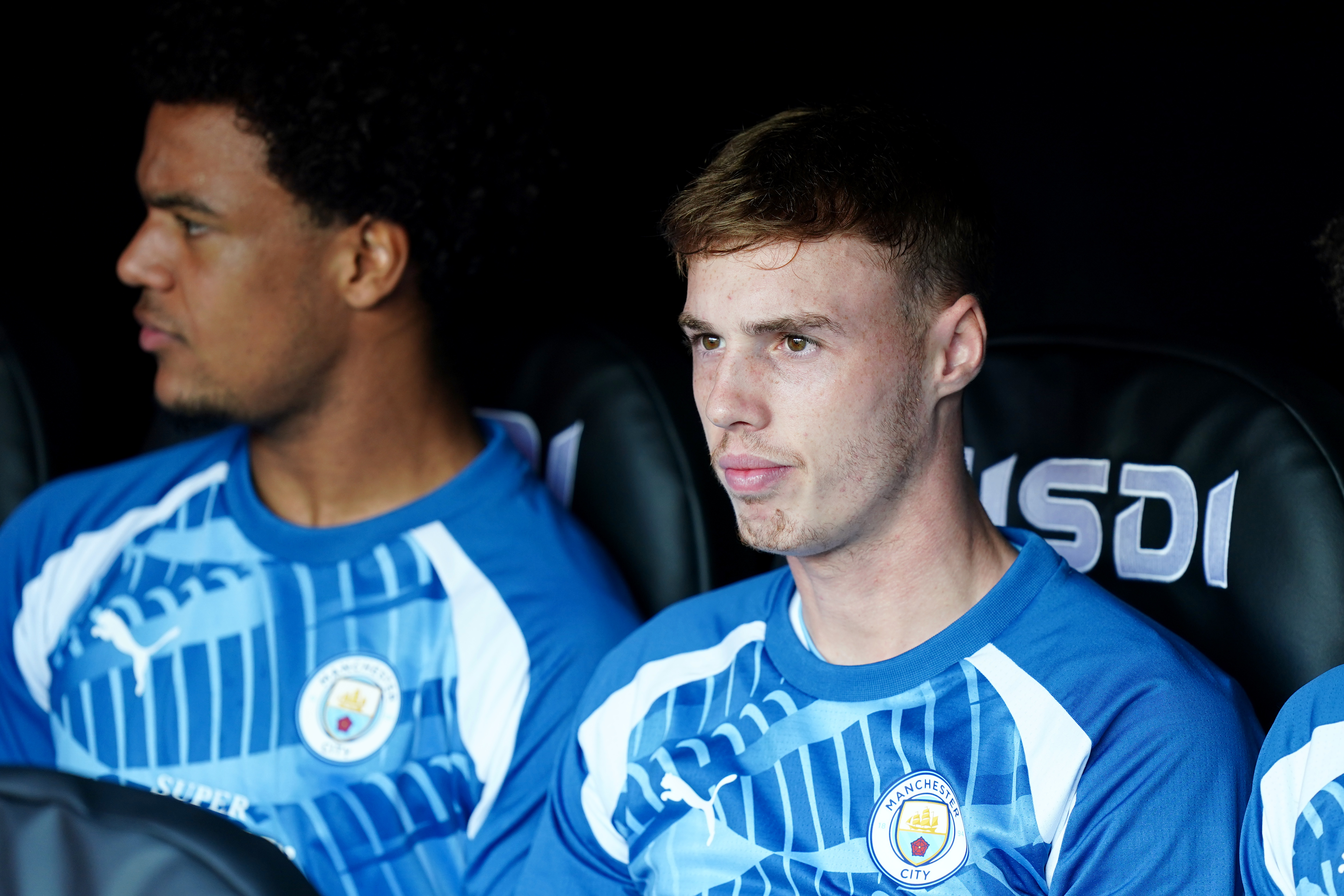 Cole Palmer, right, on the Manchester City bench