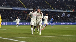 Franck Kessie and Theo Hernandez celebrate Milan's opening goal at Empoli