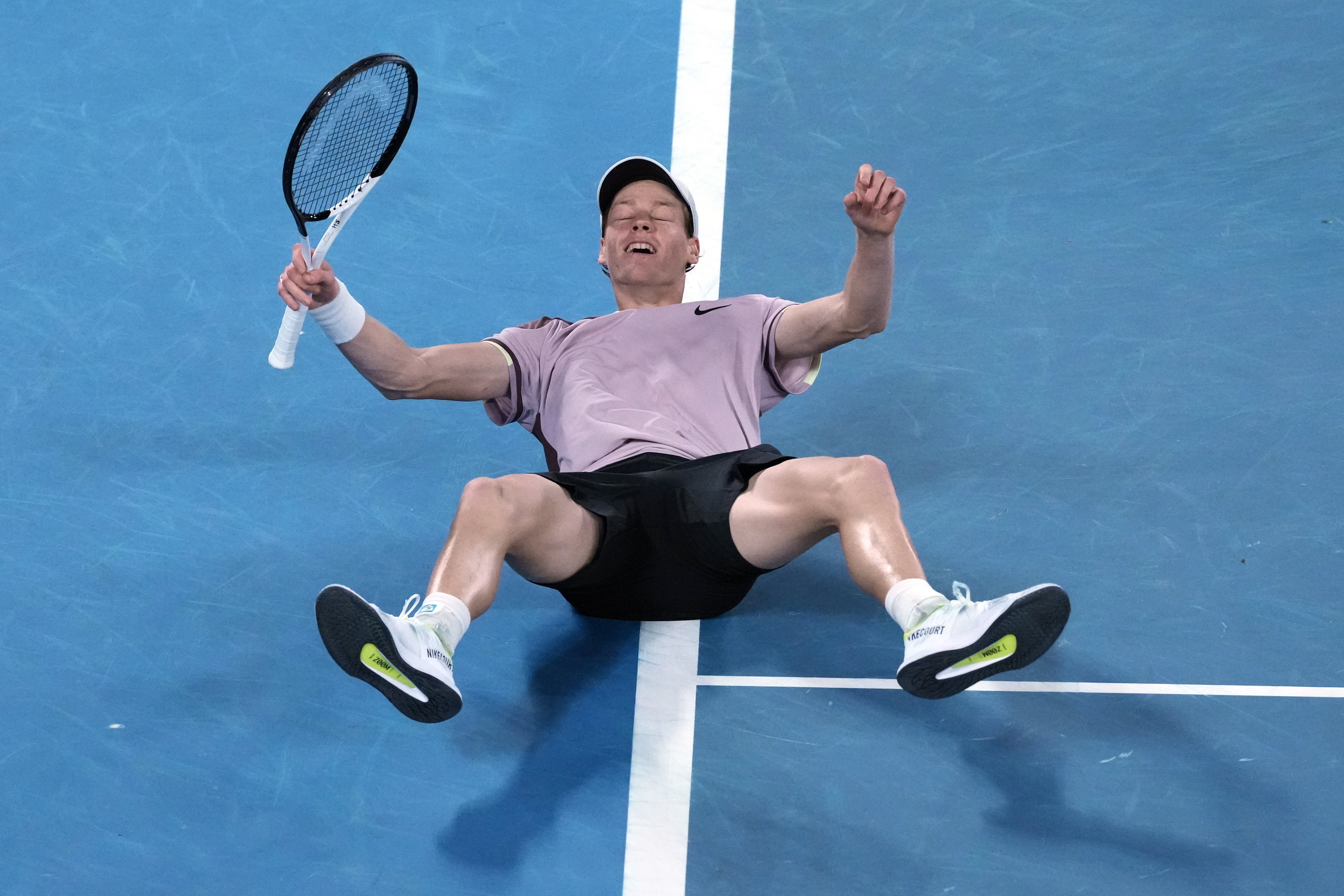 Jannik Sinner celebrates after defeating Daniil Medvedev