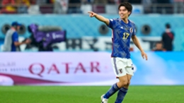 Ao Tanaka celebrates after scoring Japan's second goal against Spain at the Khalifa International Stadium.