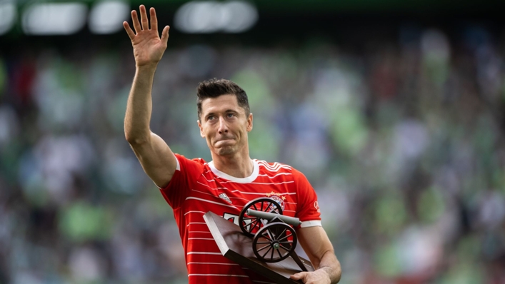 Robert Lewandowski offers a wave as he holds the Bundesliga top scorer cannon