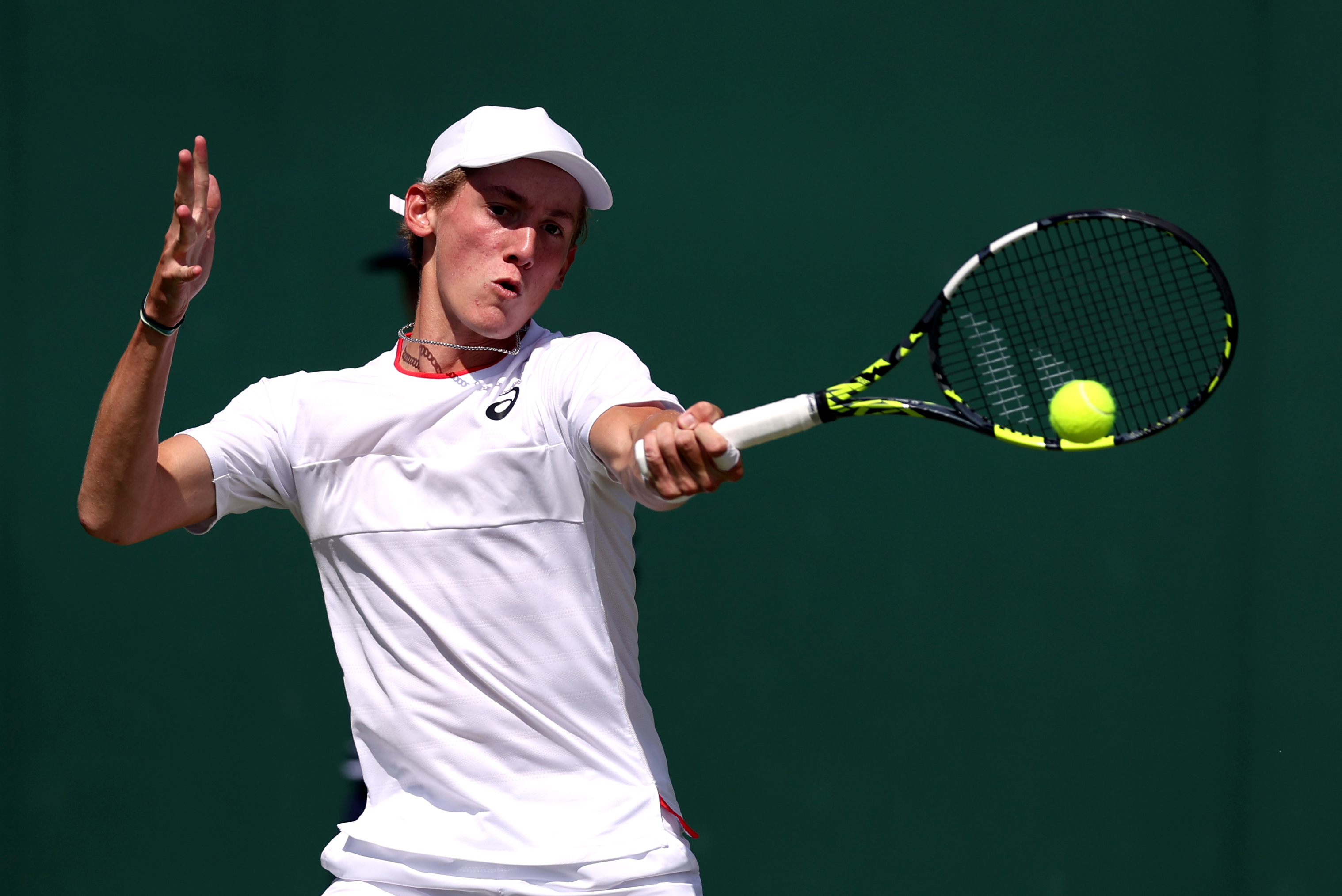 Henry Searle hits a forehand