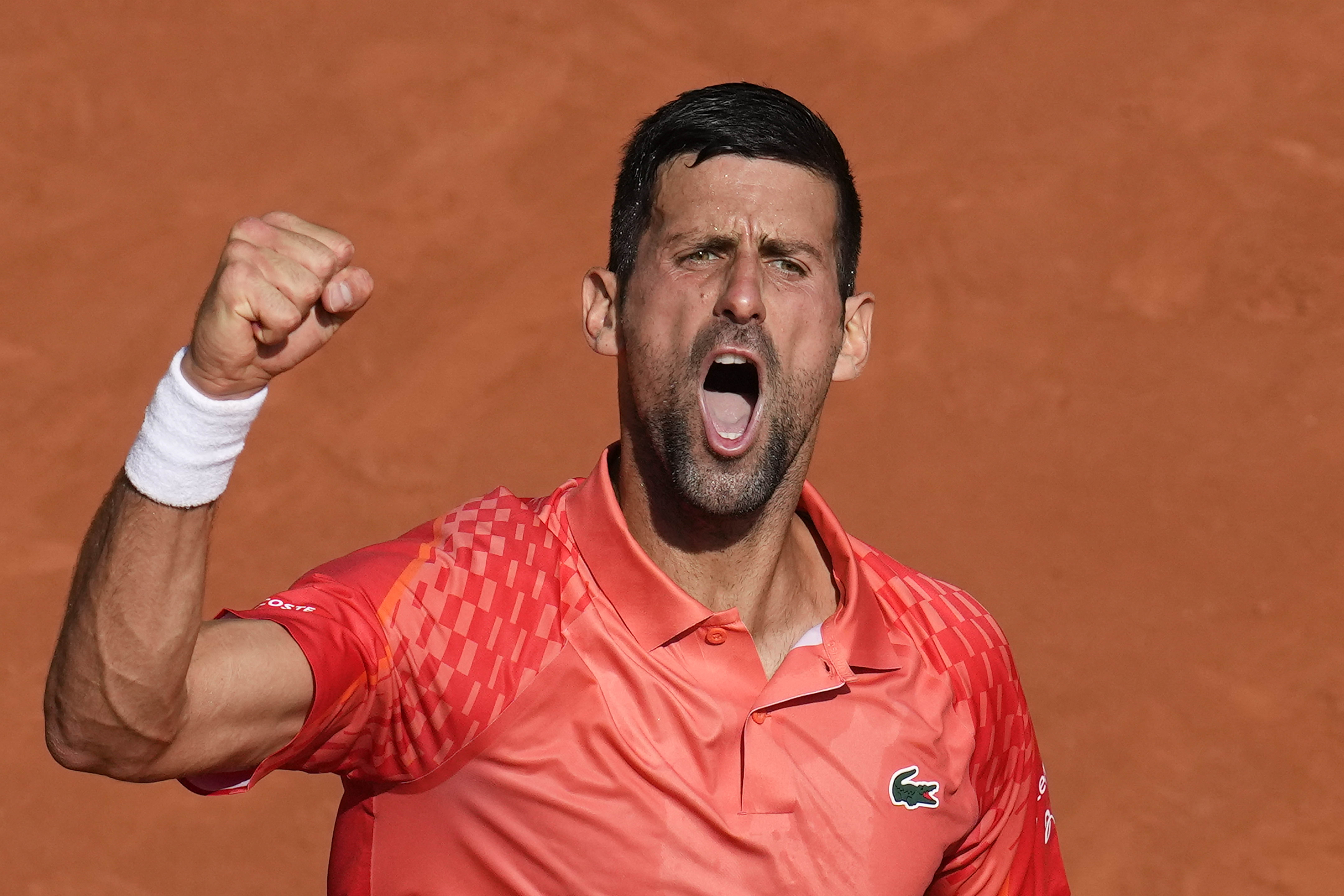 Novak Djokovic clenches his fist during his win over Carlos Alcaraz