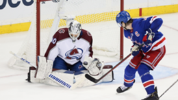 Colorado Avalanche goalie Alexandar Georgiev blocks a shot by New York Rangers defenceman Jacob Trouba