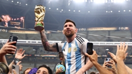 Lionel Messi with the World Cup trophy
