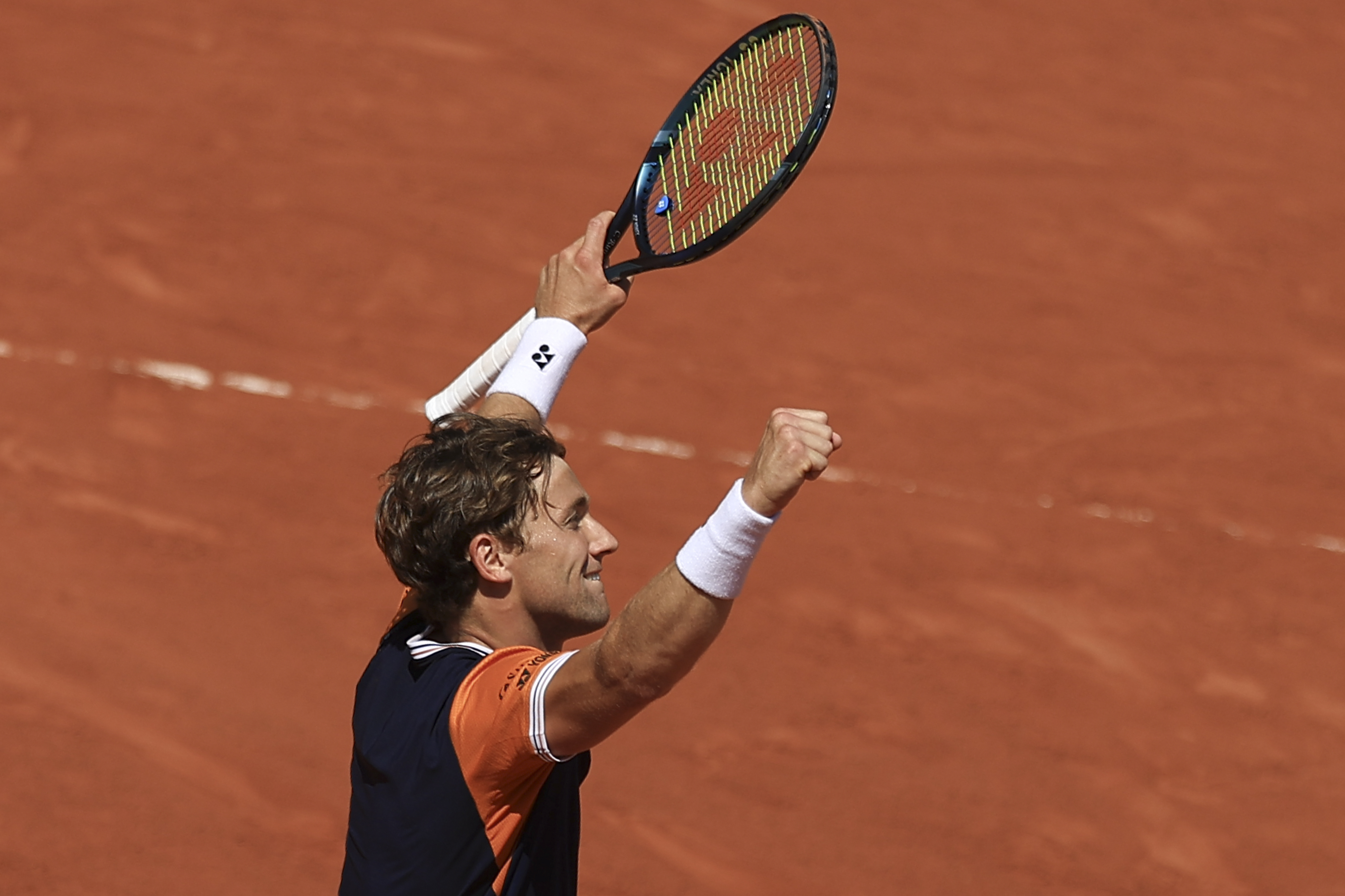 Casper Ruud celebrates winning his fourth-round match