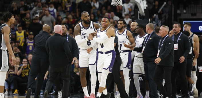 LeBron James of the Los Angeles Lakers walks with teammate Russell Westbrook after Zach Collins of the San Antonio Spurs fouled Westbrook and was given a flagrant 2