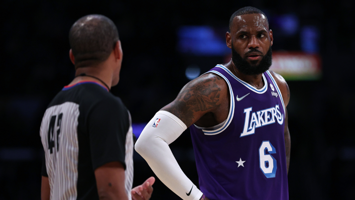 LeBron James of the Los Angeles Lakers talk with referee Eric Lewis
