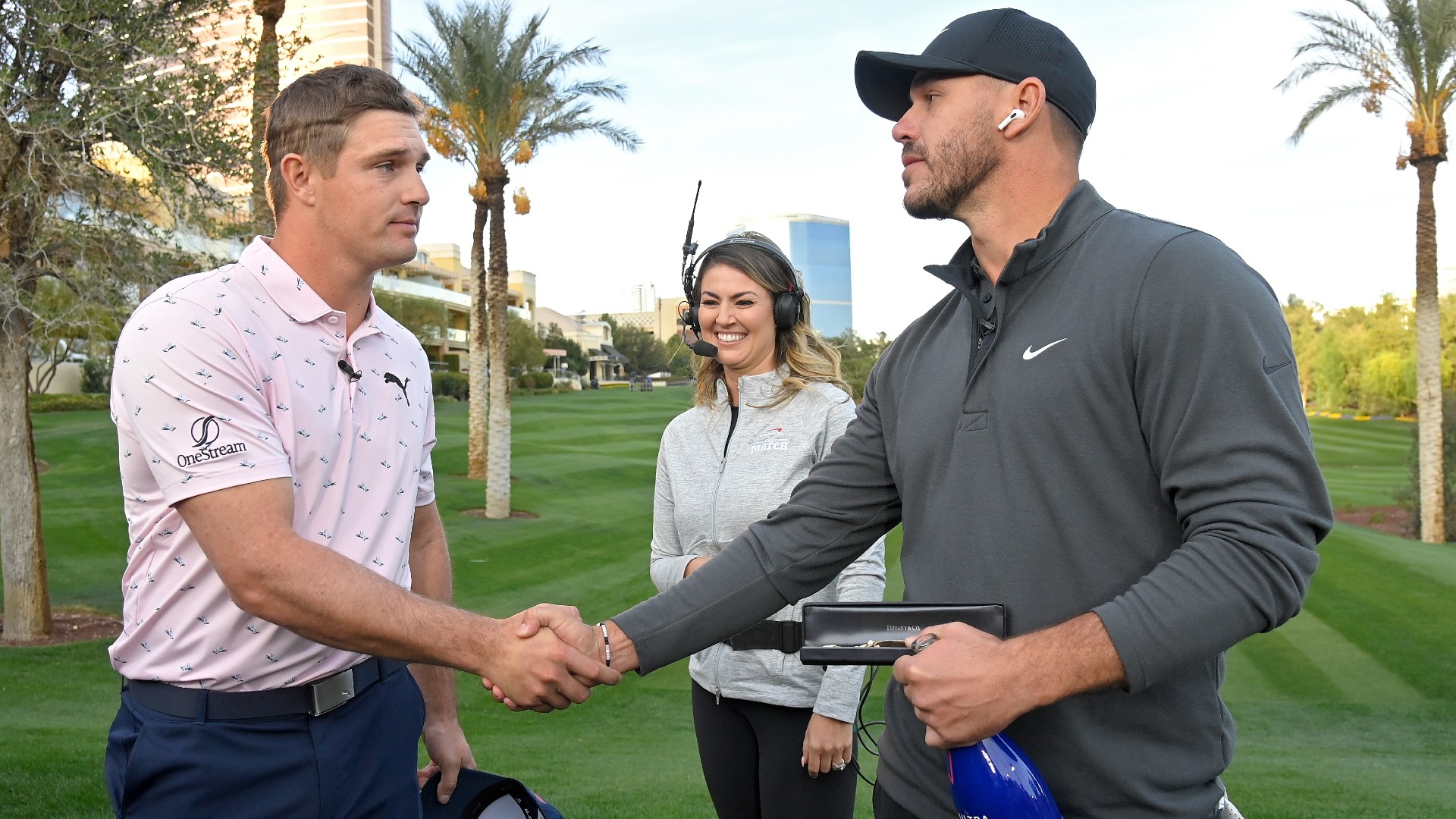 Brooks Koepka (R) after beating Bryson DeChambeau (L)