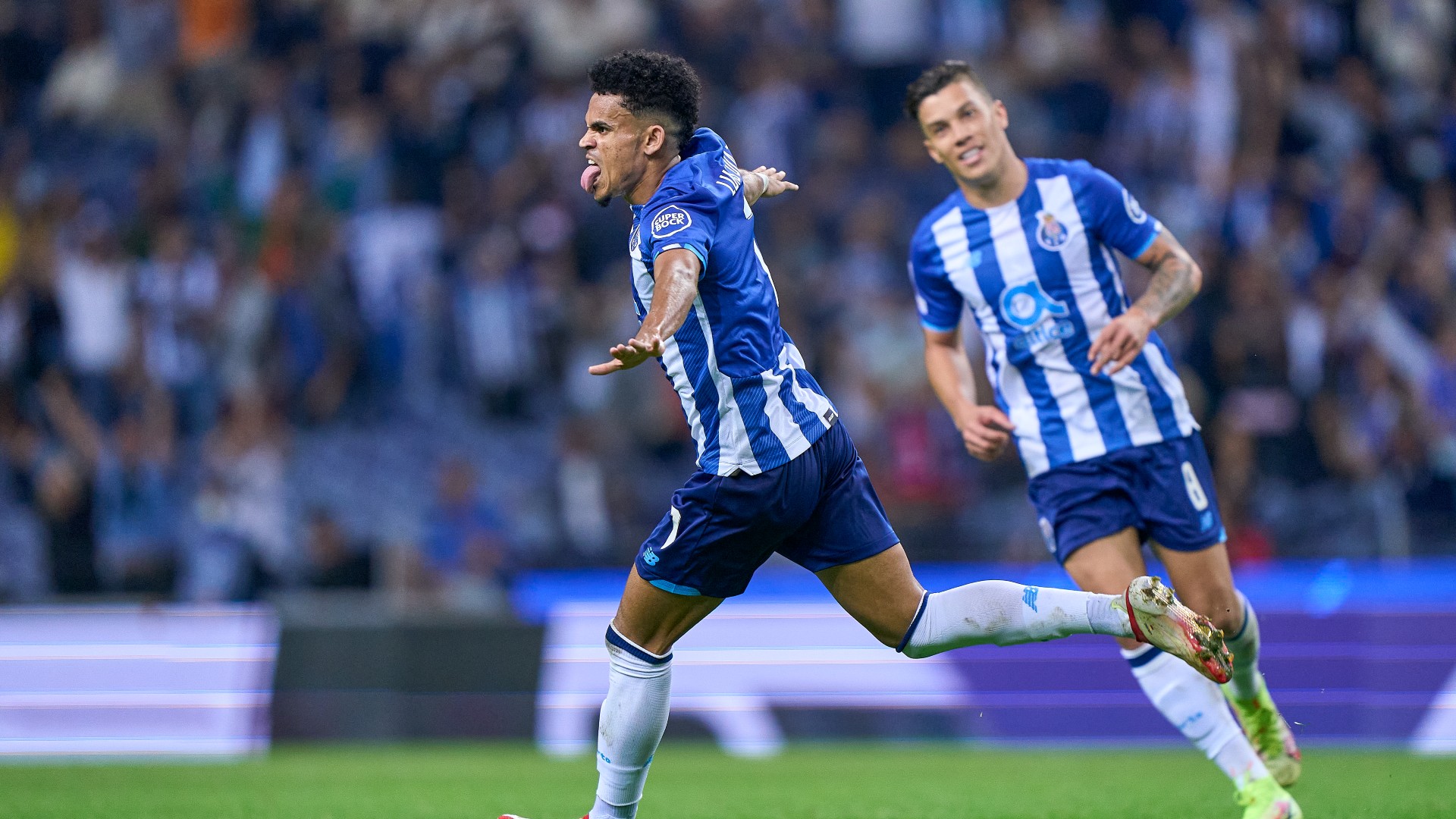 Luis Diaz wheels away in celebration after opening the scoring for Porto against Milan