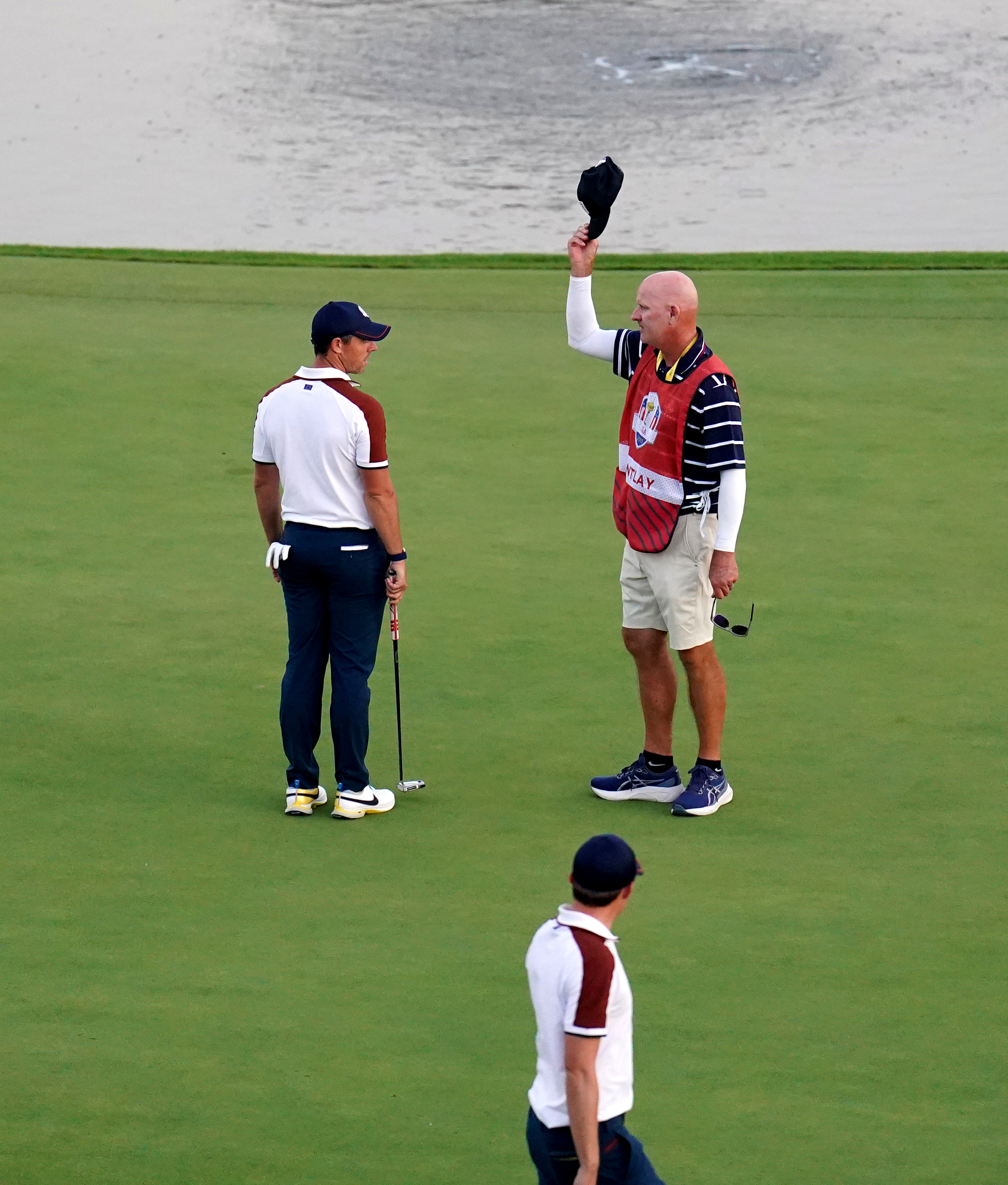 Rory McIlroy (left) argues with Joe LaCava