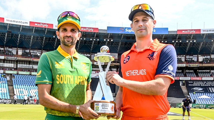 Captains Keshav Maharaj of South Africa and Pieter Seelaar of Netherlands pose with the series trophy