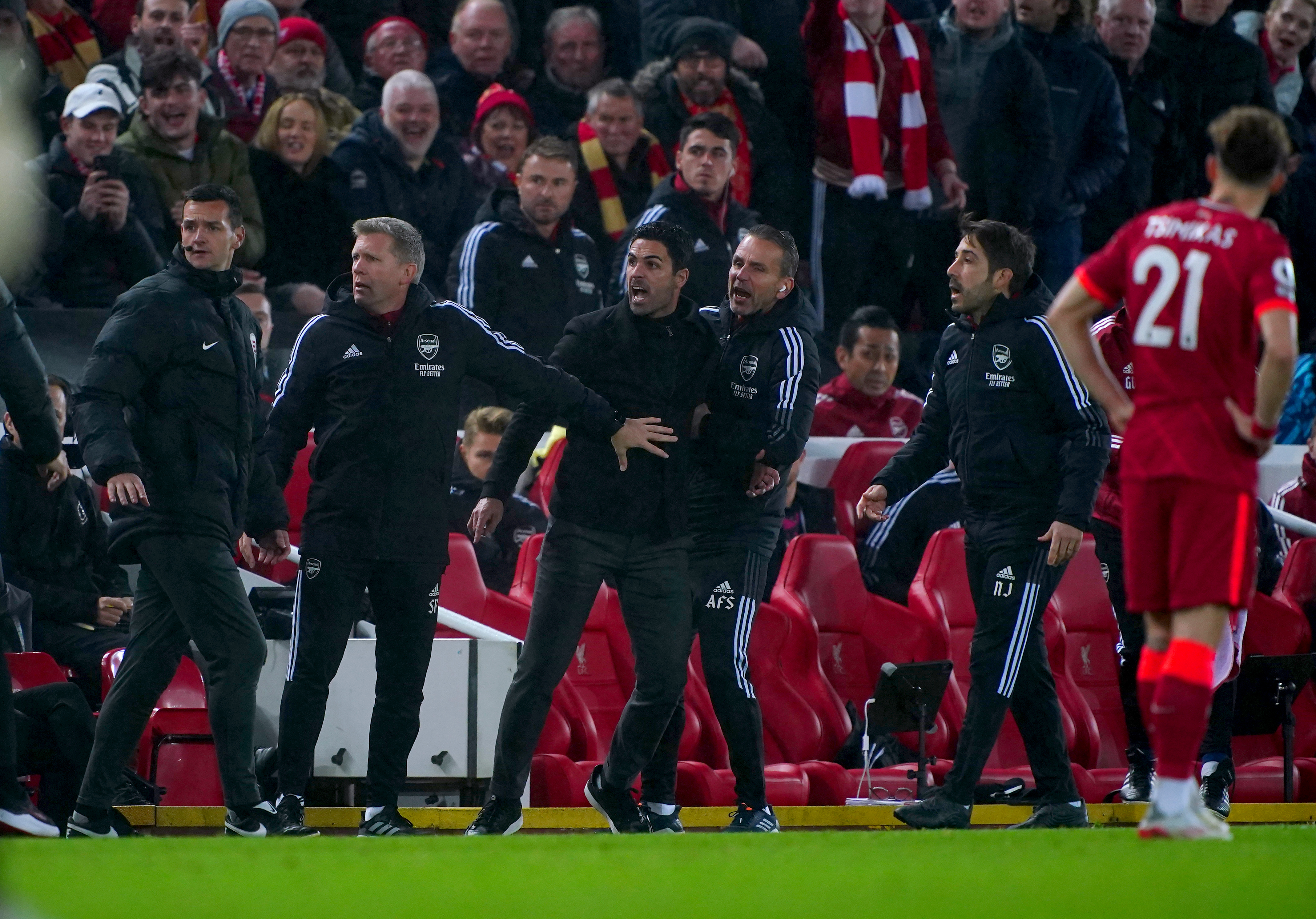 Arsenal manager Mikel Arteta (centre) exchanges words with Liverpool manager Jurgen Klopp (not pictured) during the Premier League match at Anfield in 2021