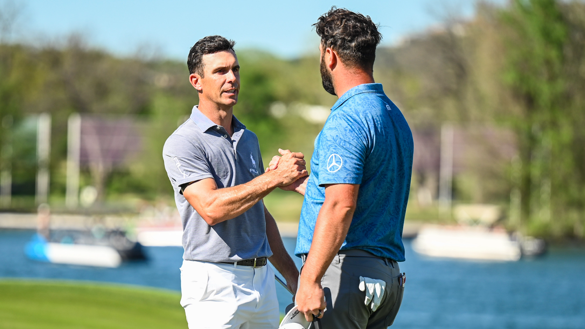 Billy Horschel shakes hands with Jon Rahm