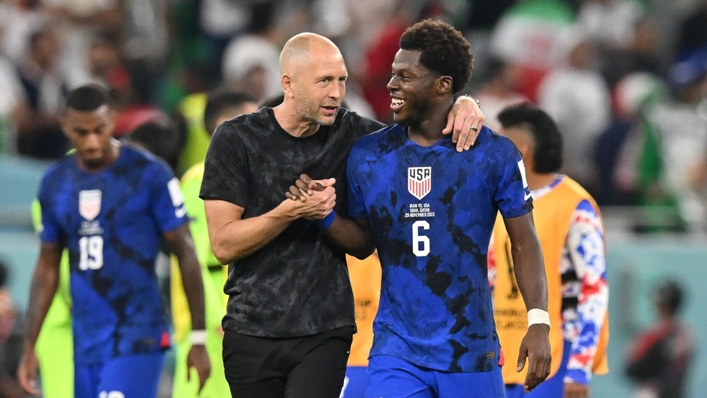 Gregg Berhalter celebrates the United States' win over Iran with midfielder Yunus Musah