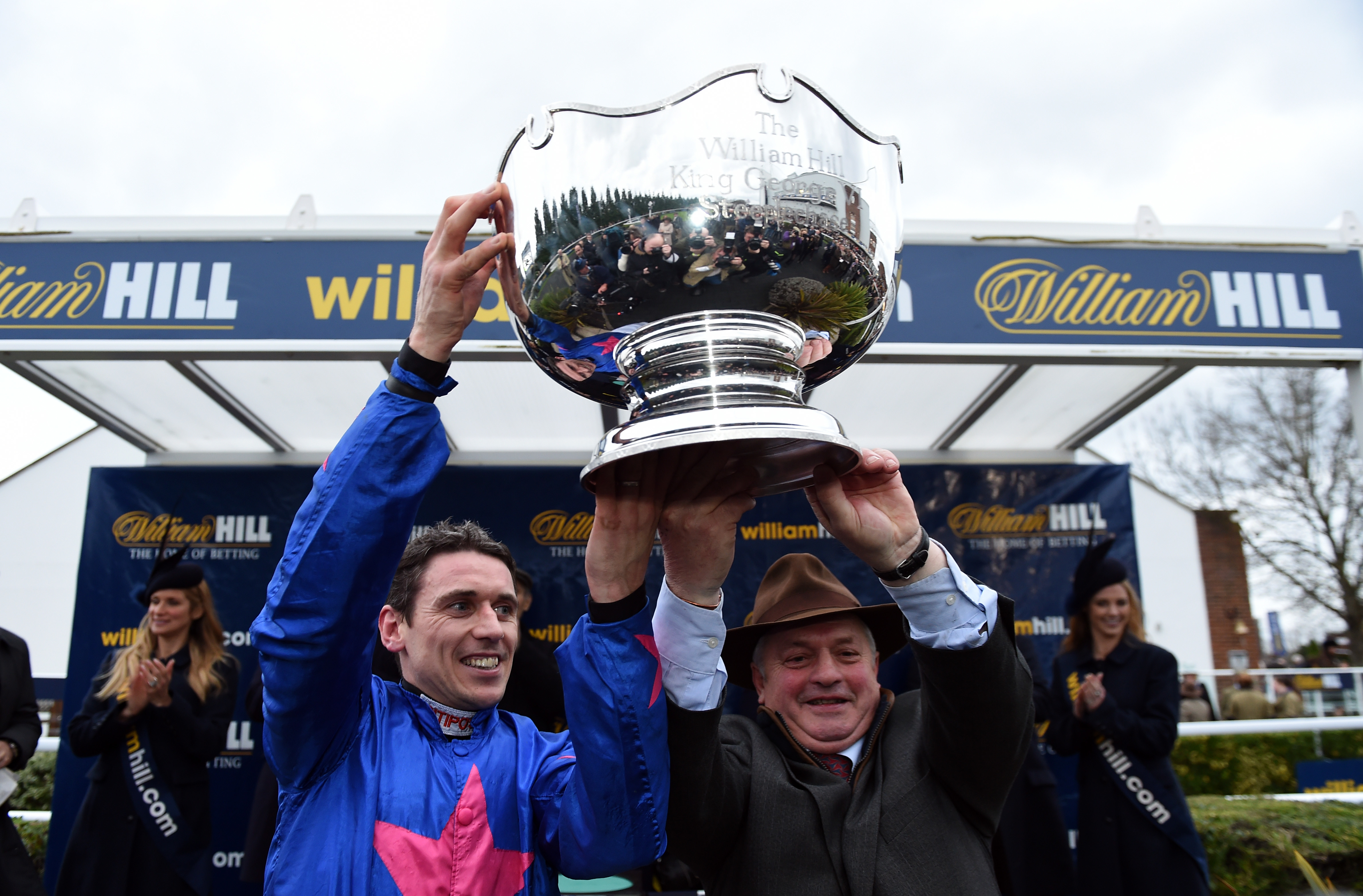 Paddy Brennan and trainer Colin Tizzard celebrate Cue Card's King George win