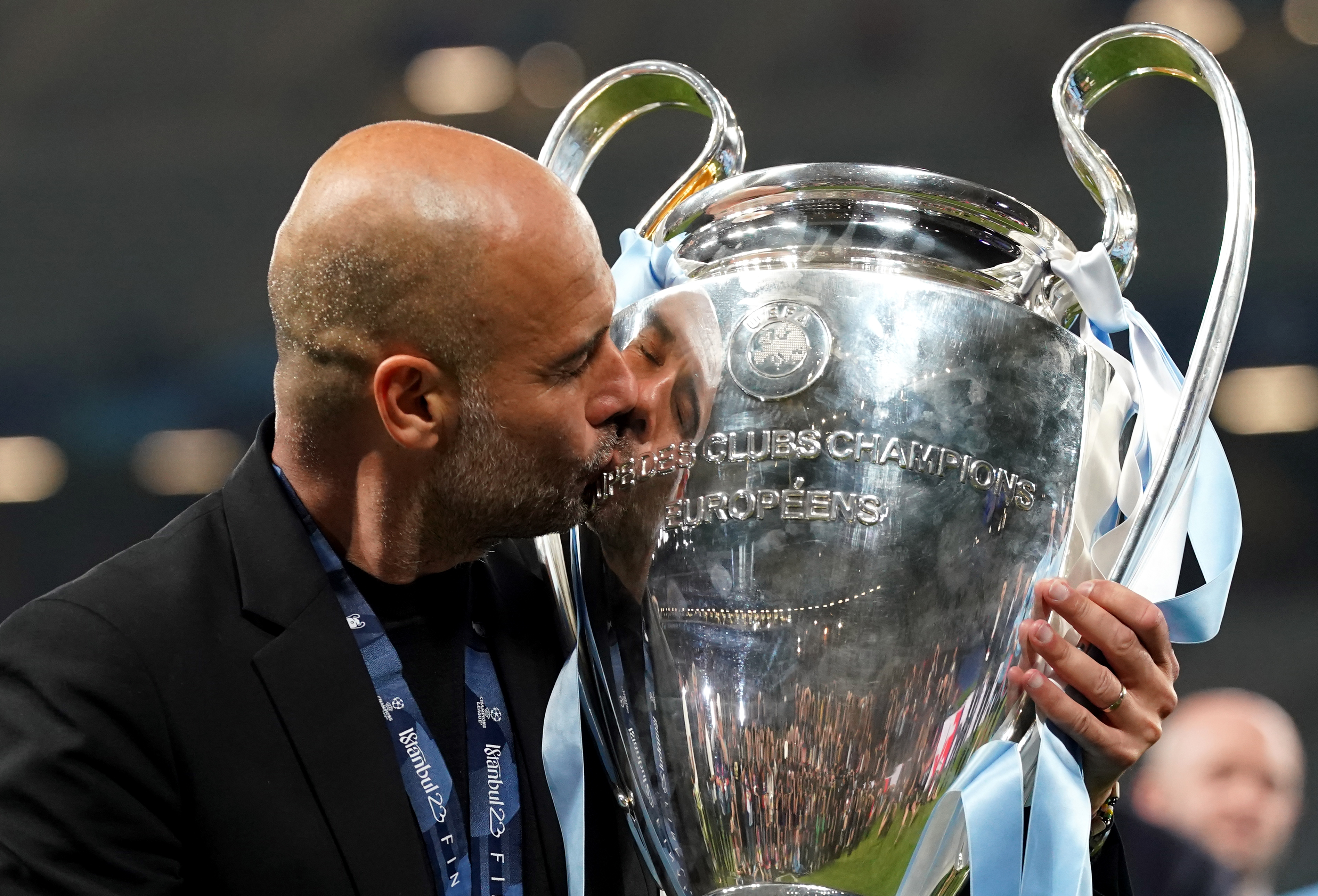 Pep Guardiola kisses the Champions League trophy