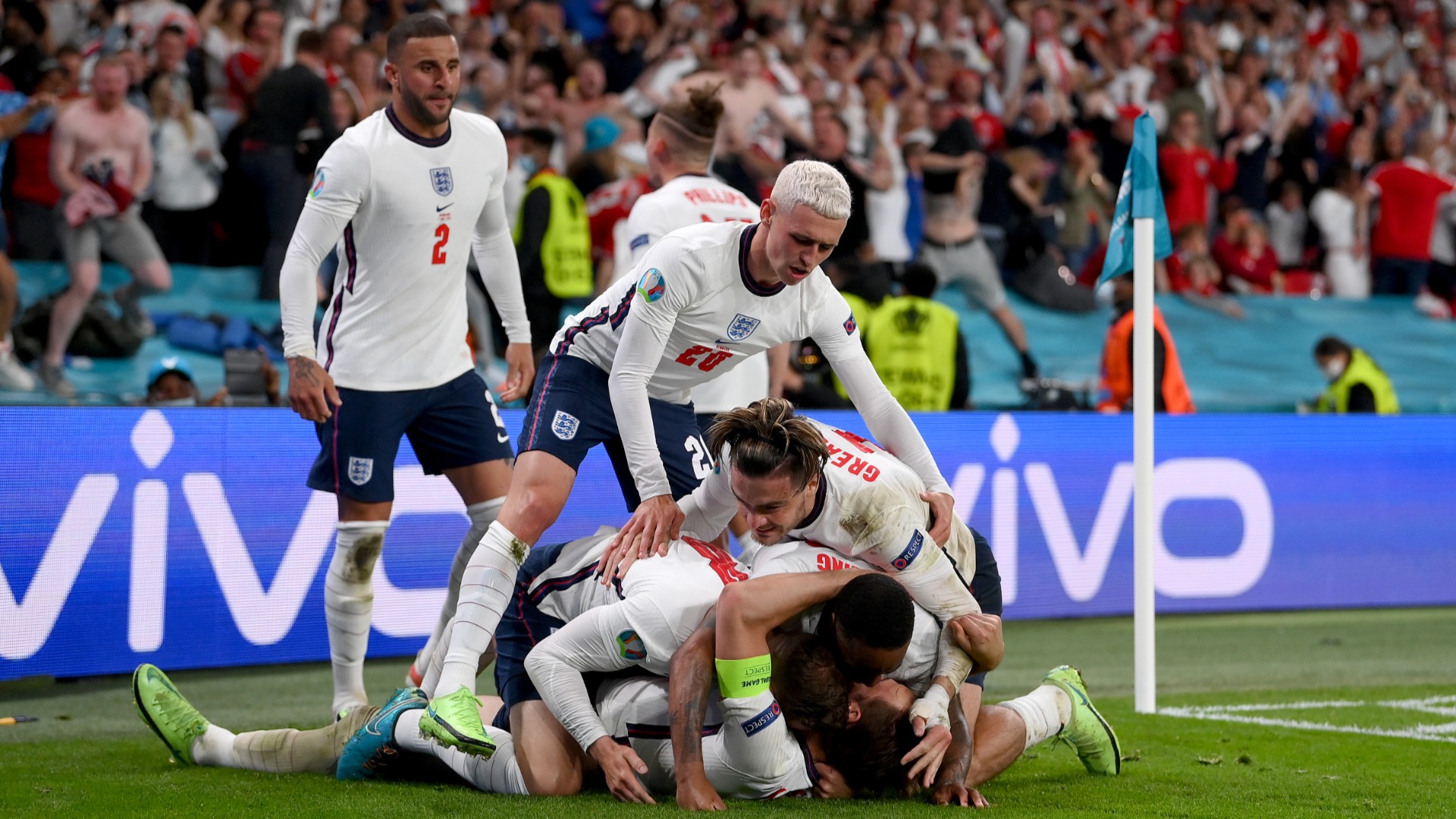 England players celebrate Harry Kane's decisive goal against Denmark