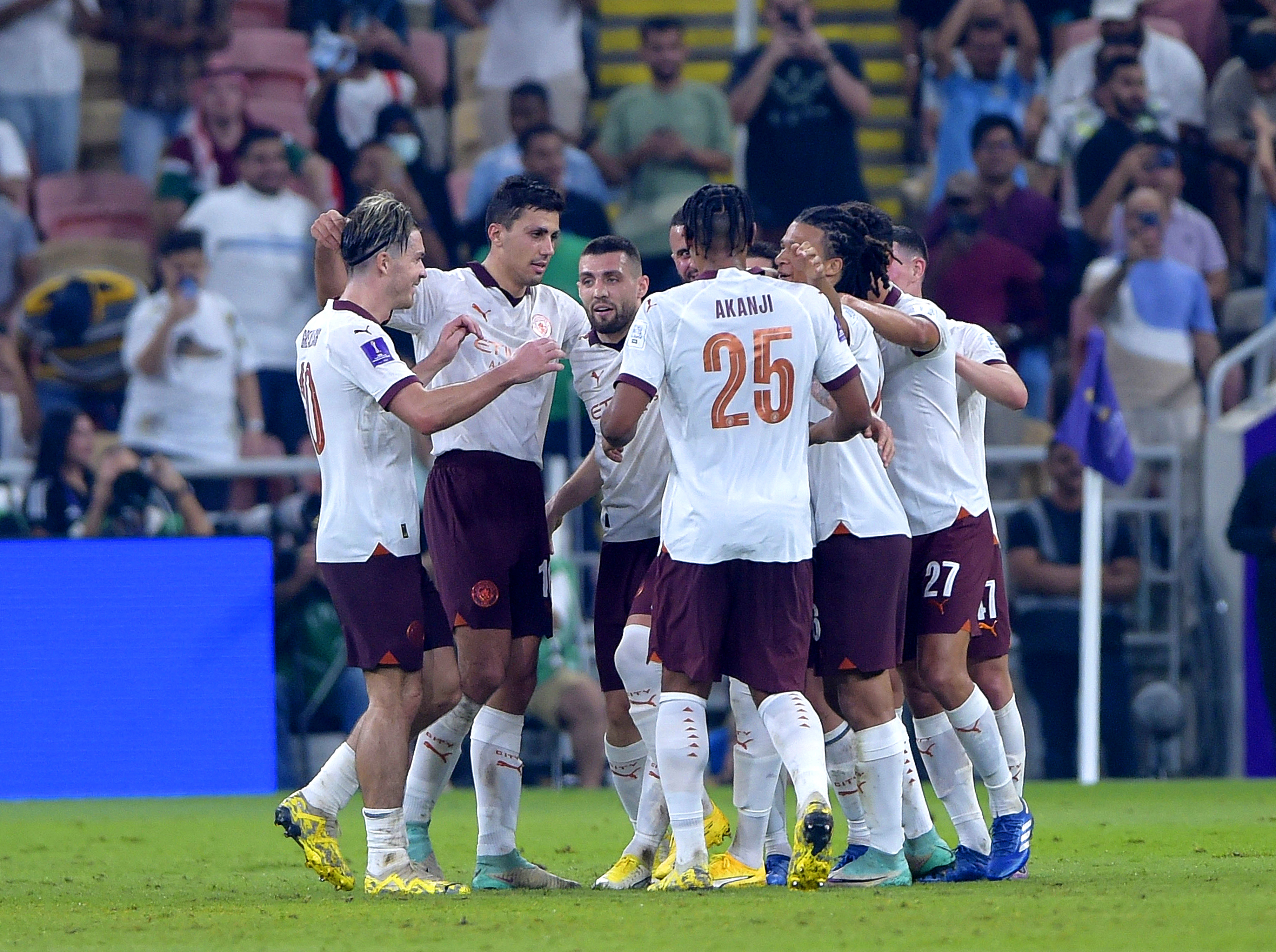 Manchester City celebrate scoring against Urawa Red Diamonds