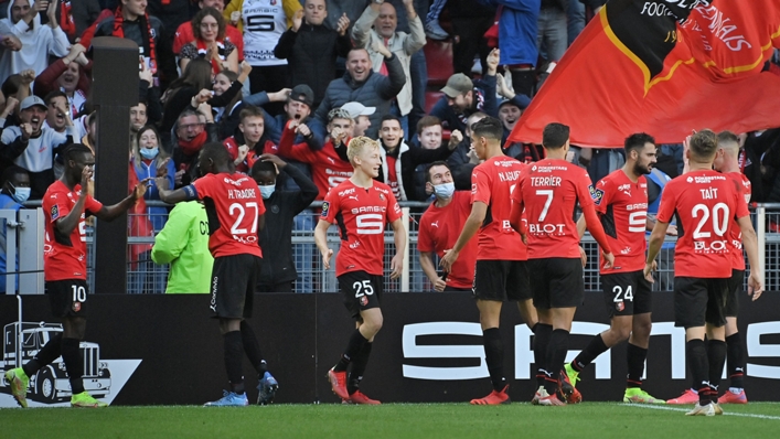 Rennes' players celebrate after scoring against PSG