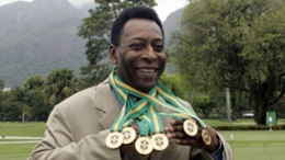 Pele poses with medals won during his Santos career