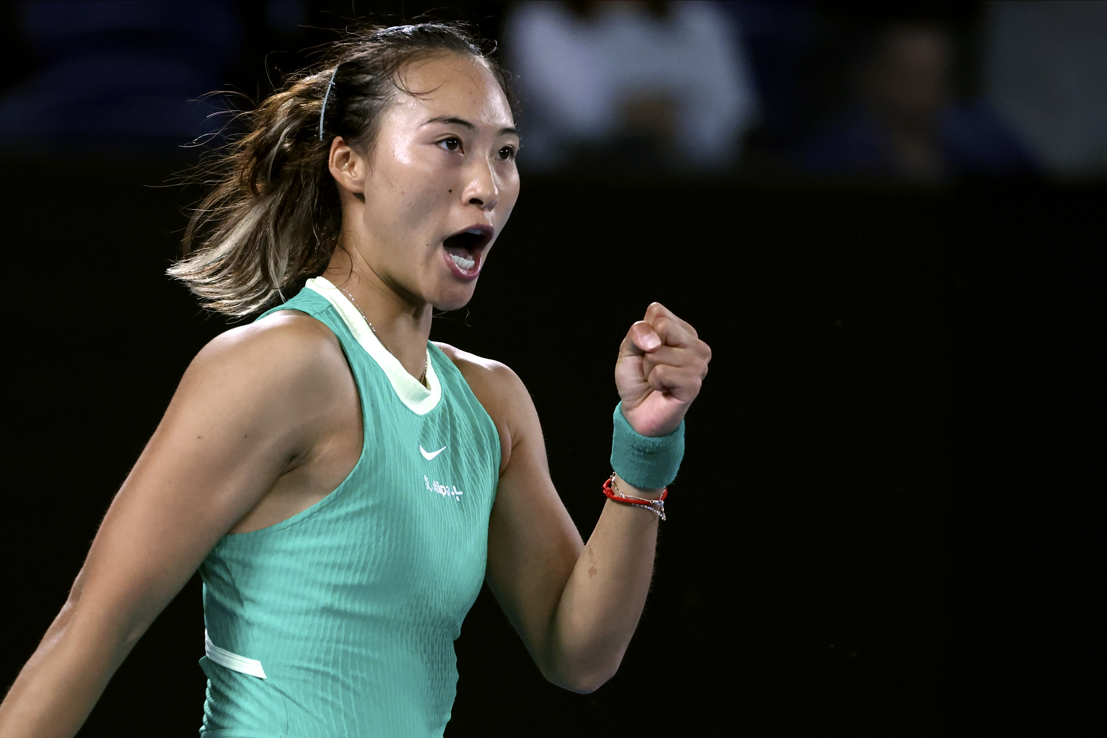 Zheng Qinwen clenches her fist