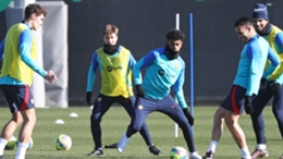 Lamine Yamal (centre) pictured in training with Barcelona's first team
