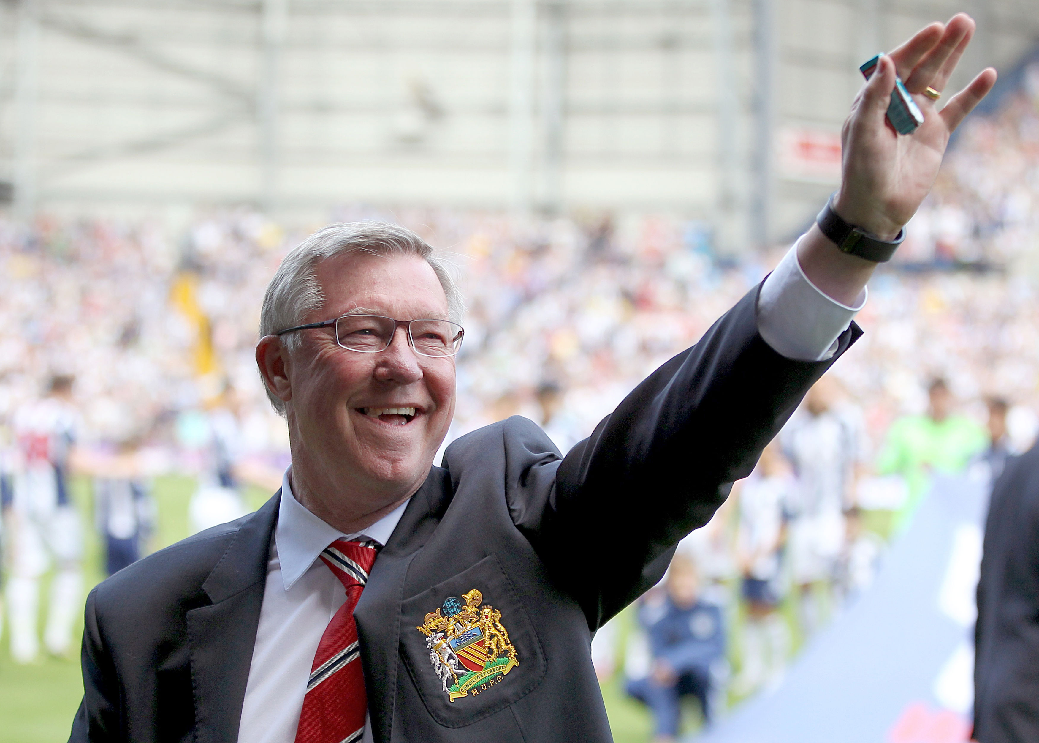 Manchester United manager Sir Alex Ferguson salutes the fans before his final game in charge, a 5-5 Premier League draw at West Brom