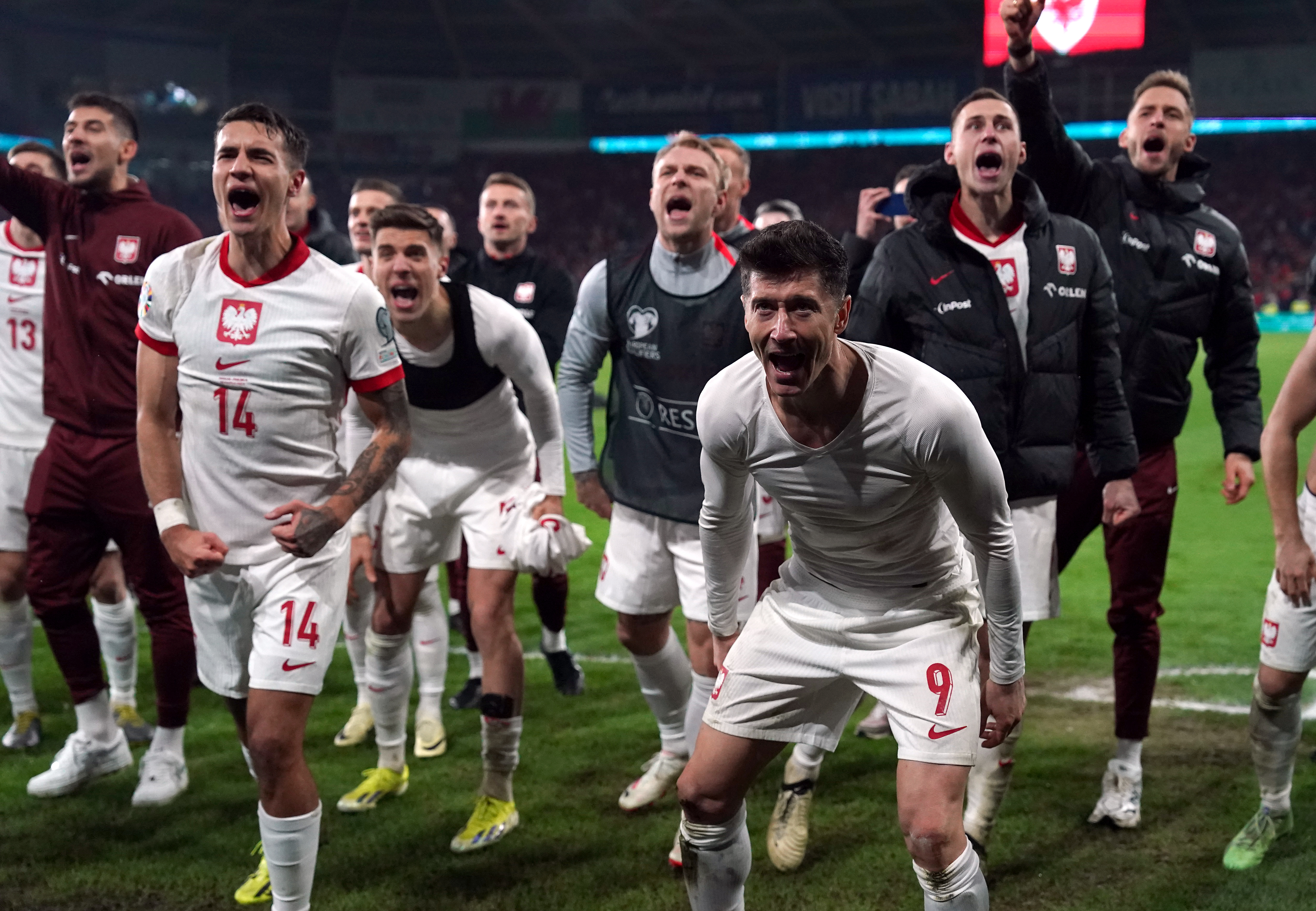 Robert Lewandowski celebrates Poland's penalty shoot-out win in Wales on Tuesday