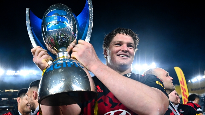 Scott Barrett of the Crusaders holds the Super Rugby Pacific trophy after beating the Blues at Eden Park