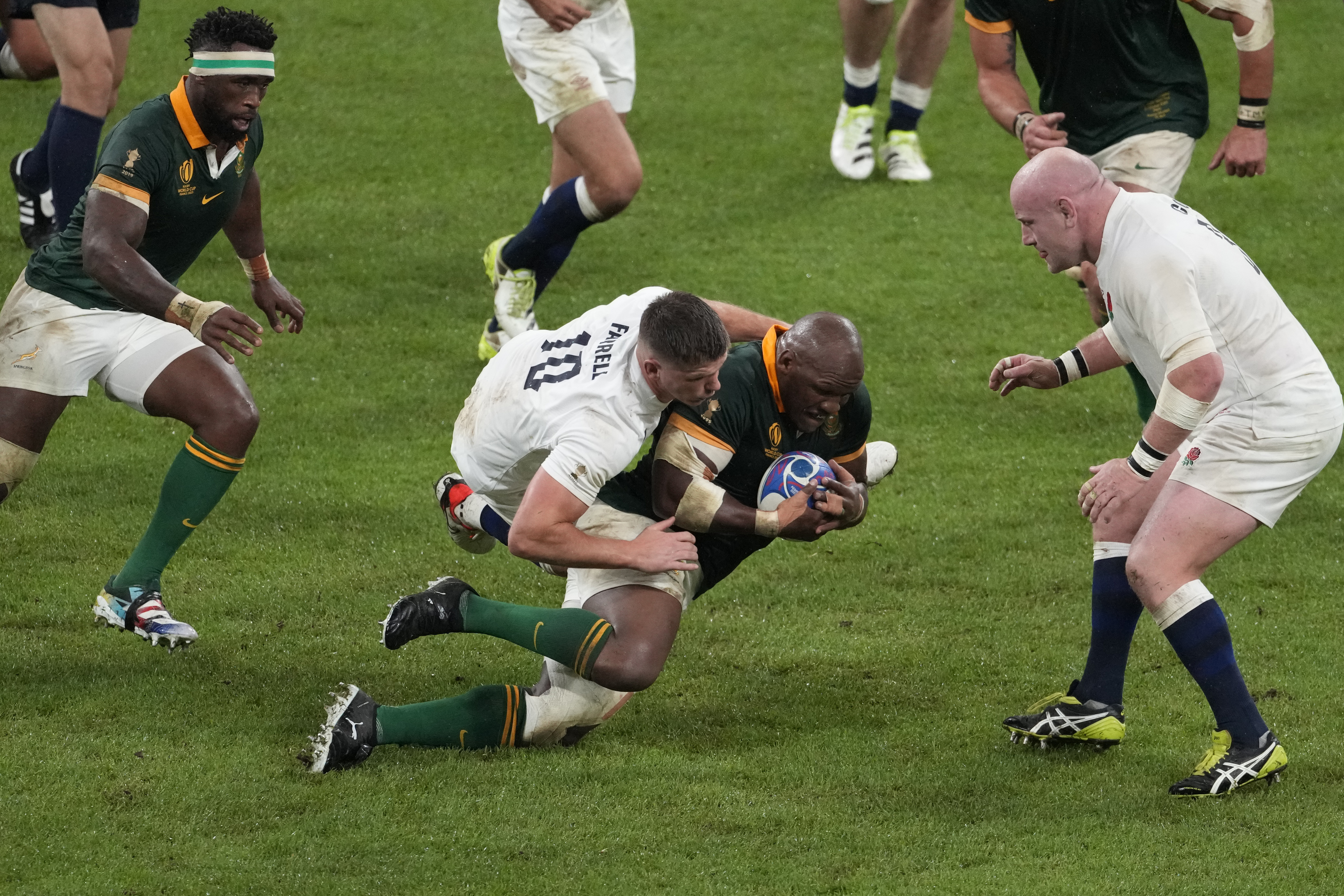 Mbongeni Mbonambi is tackled by England’s Owen Farrell