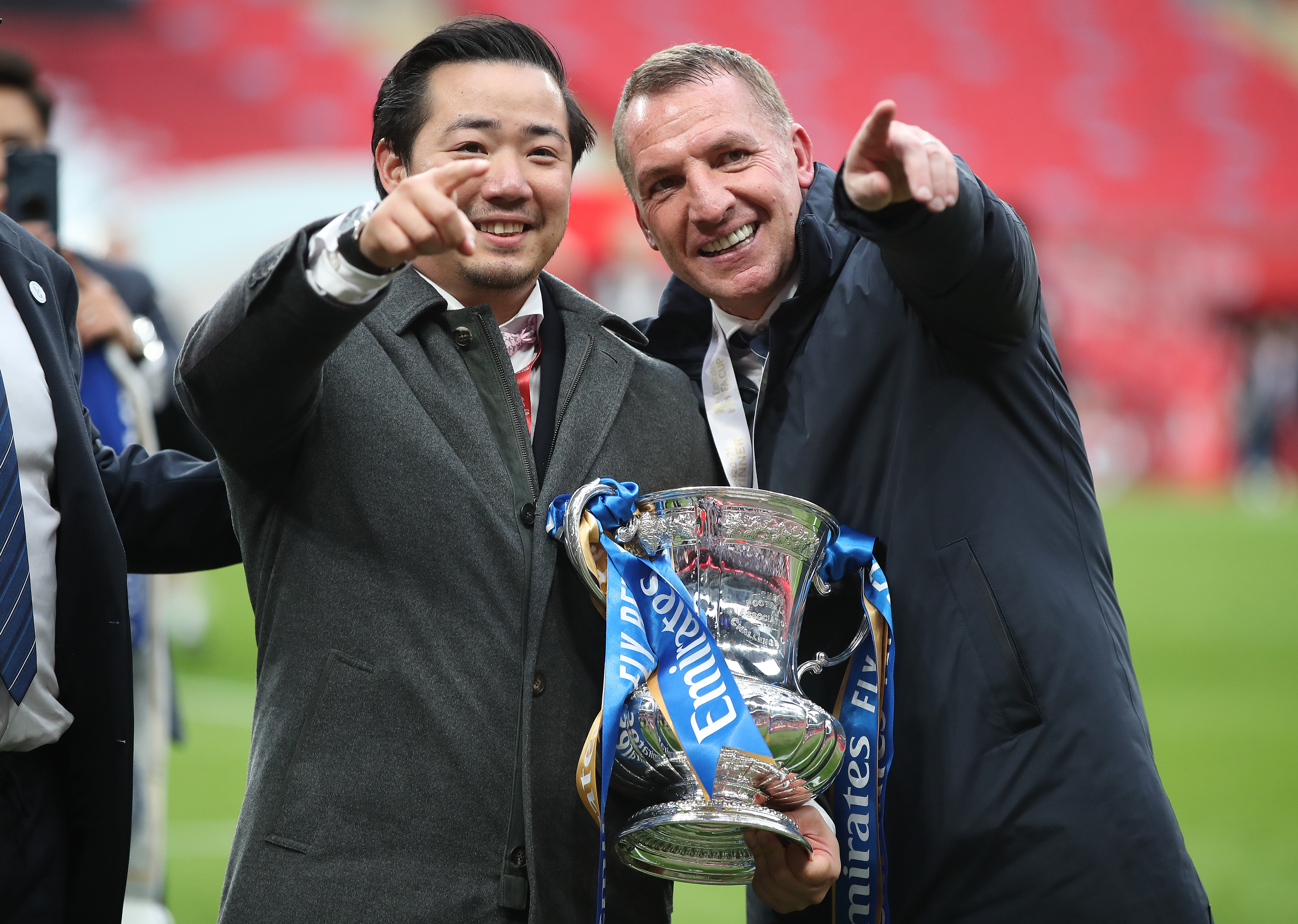 Leicester chairman Aiyawatt Srivaddhanaprabha, left, and manager Brendan Rodgers with the FA Cup trophy