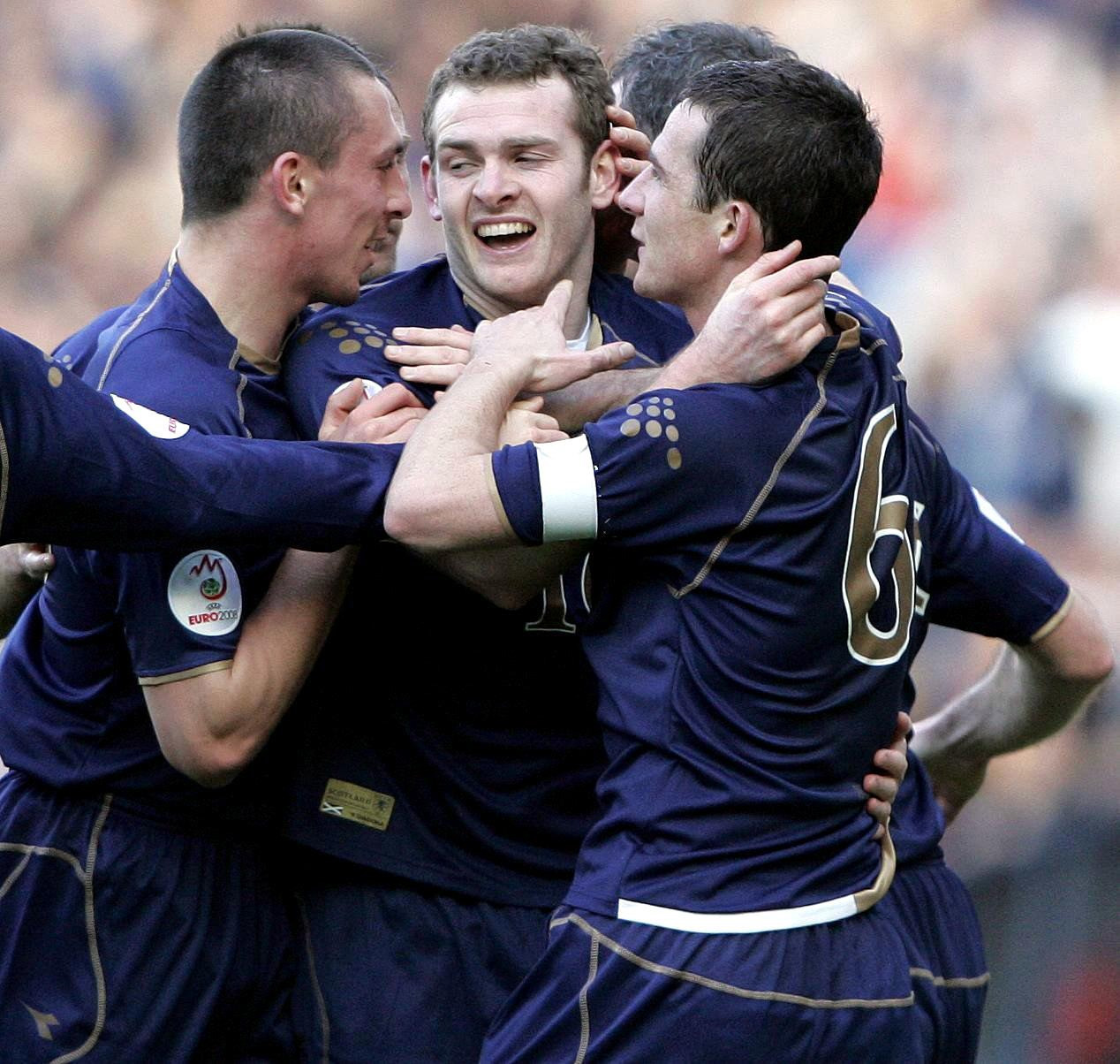 Craig Beattie, centre, celebrates