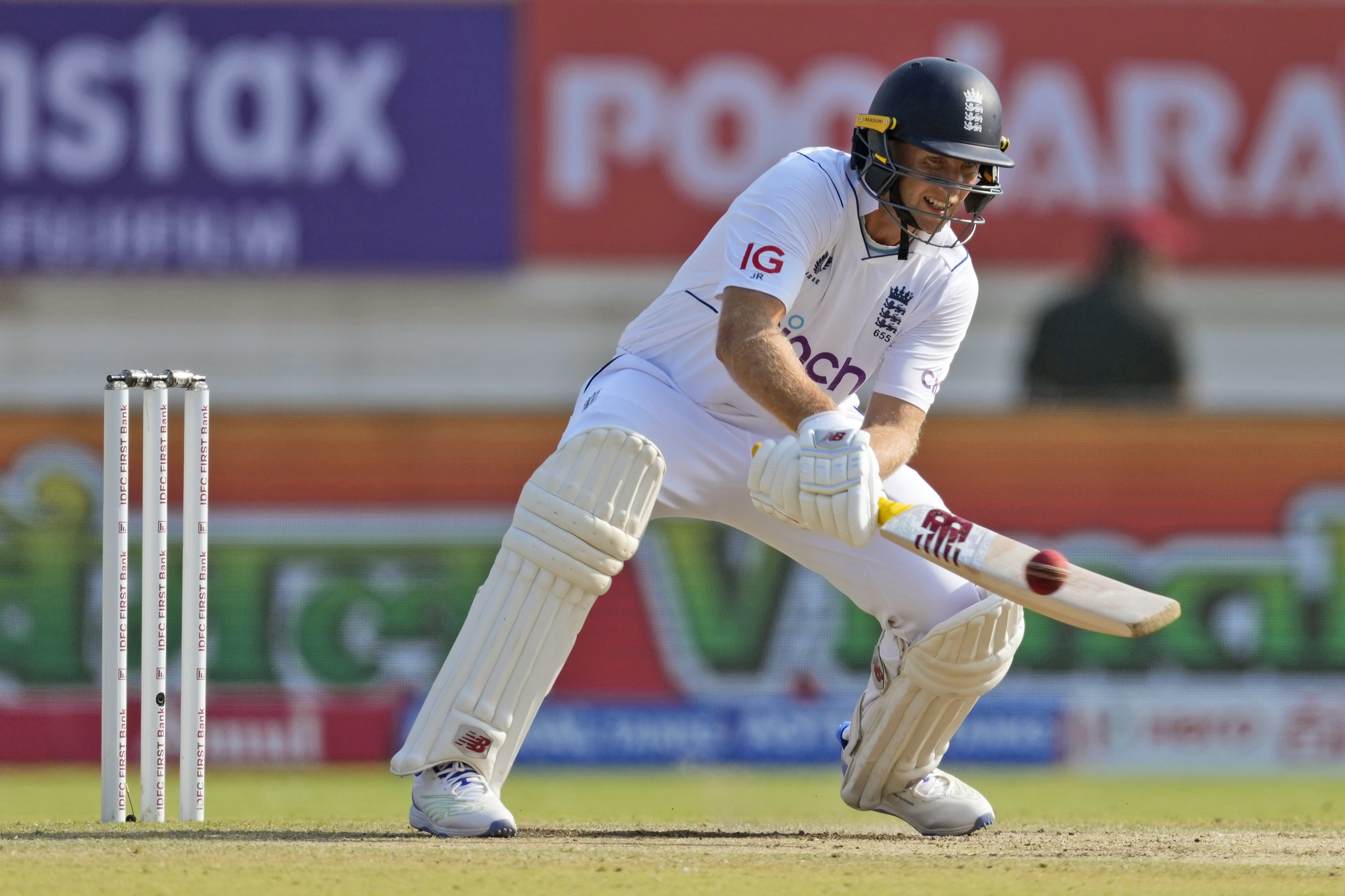 England’s Joe Root plays a reverse ramp shot in the third Test in Rajkot