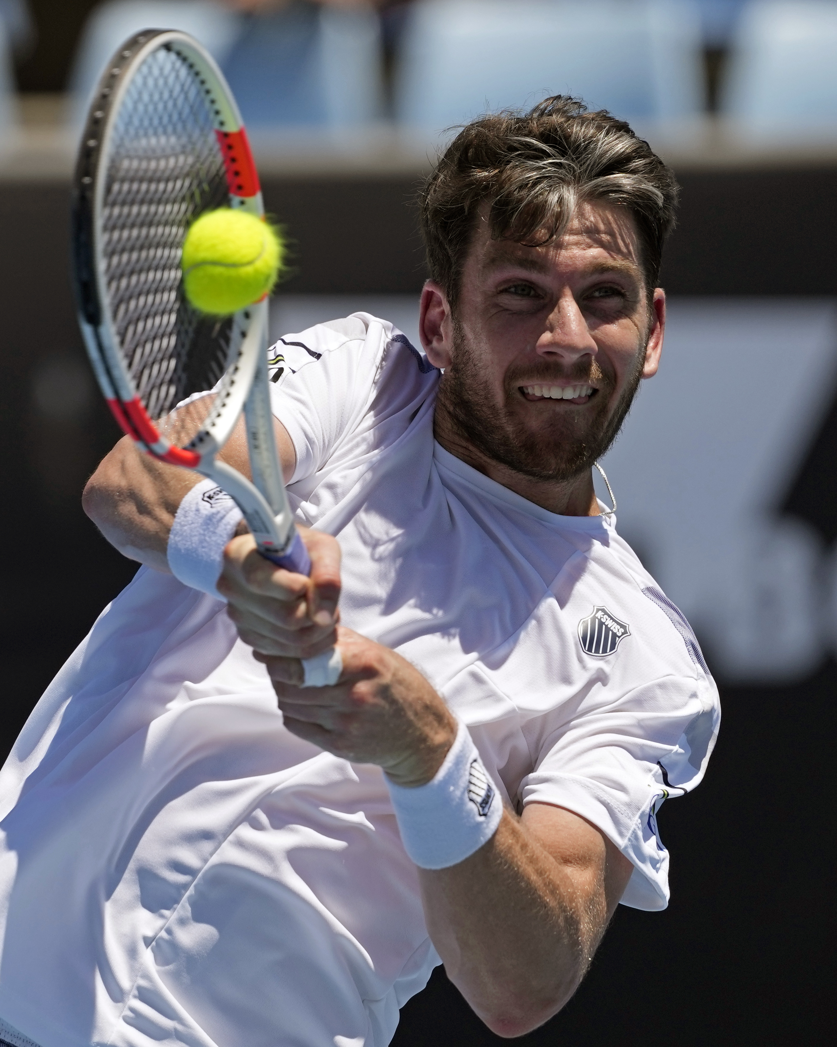 Cameron Norrie hits a backhand
