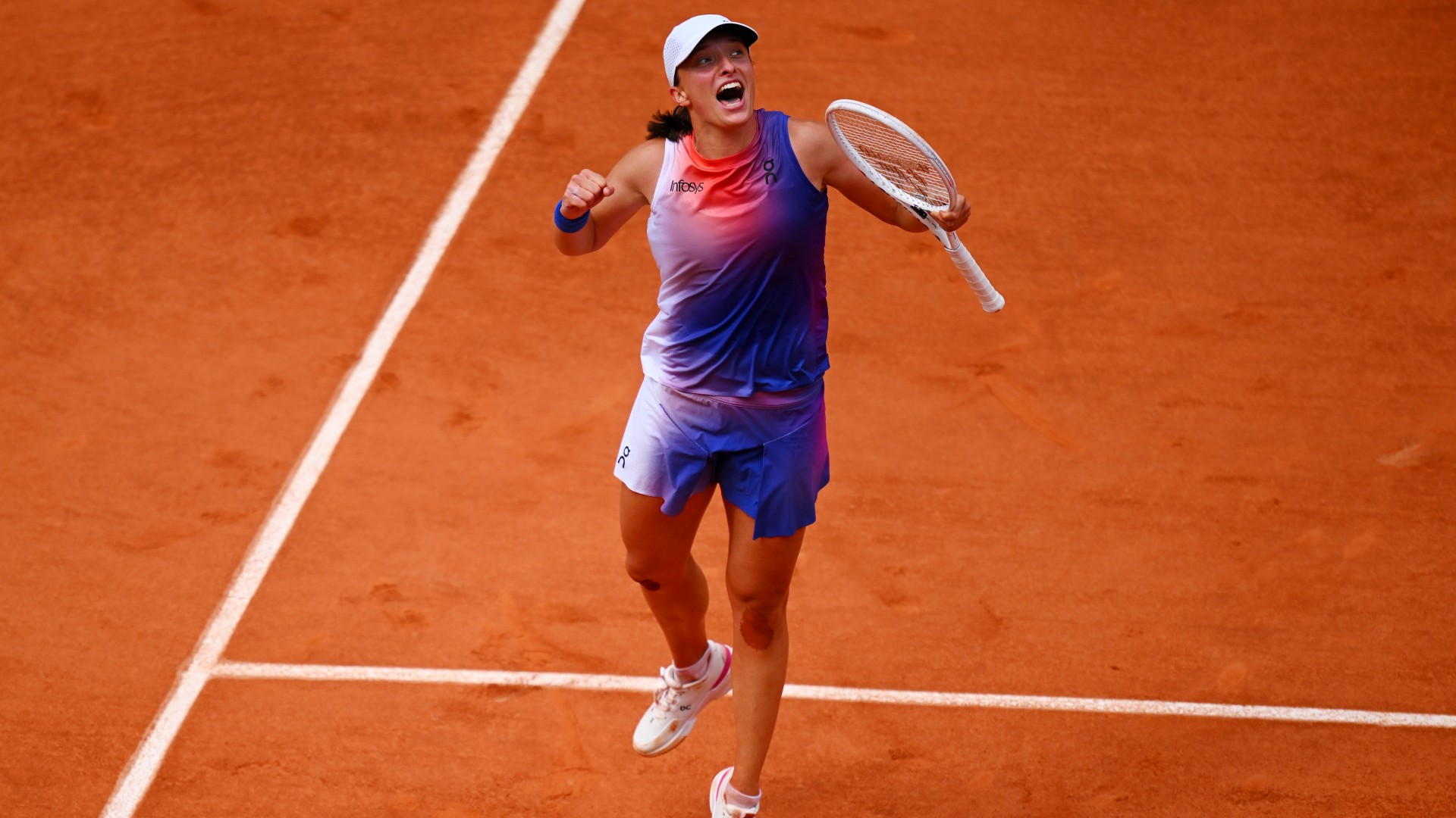Swiatek storms to third consecutive French Open title with Paolini win