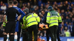 Cesar Azpilicueta is carried from the field at Stamford Bridge