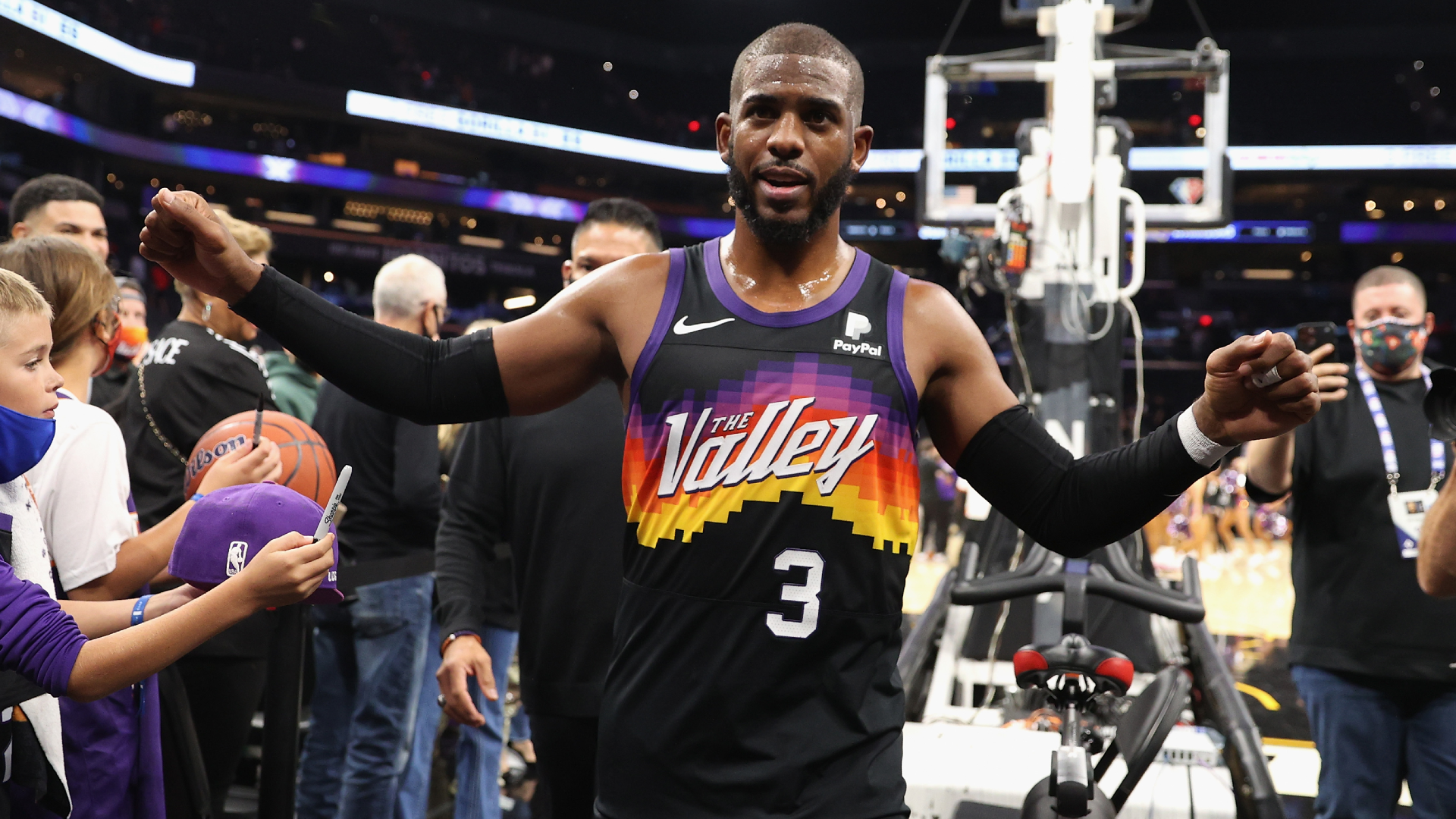 Chris Paul of the Phoenix Suns high fives fans
