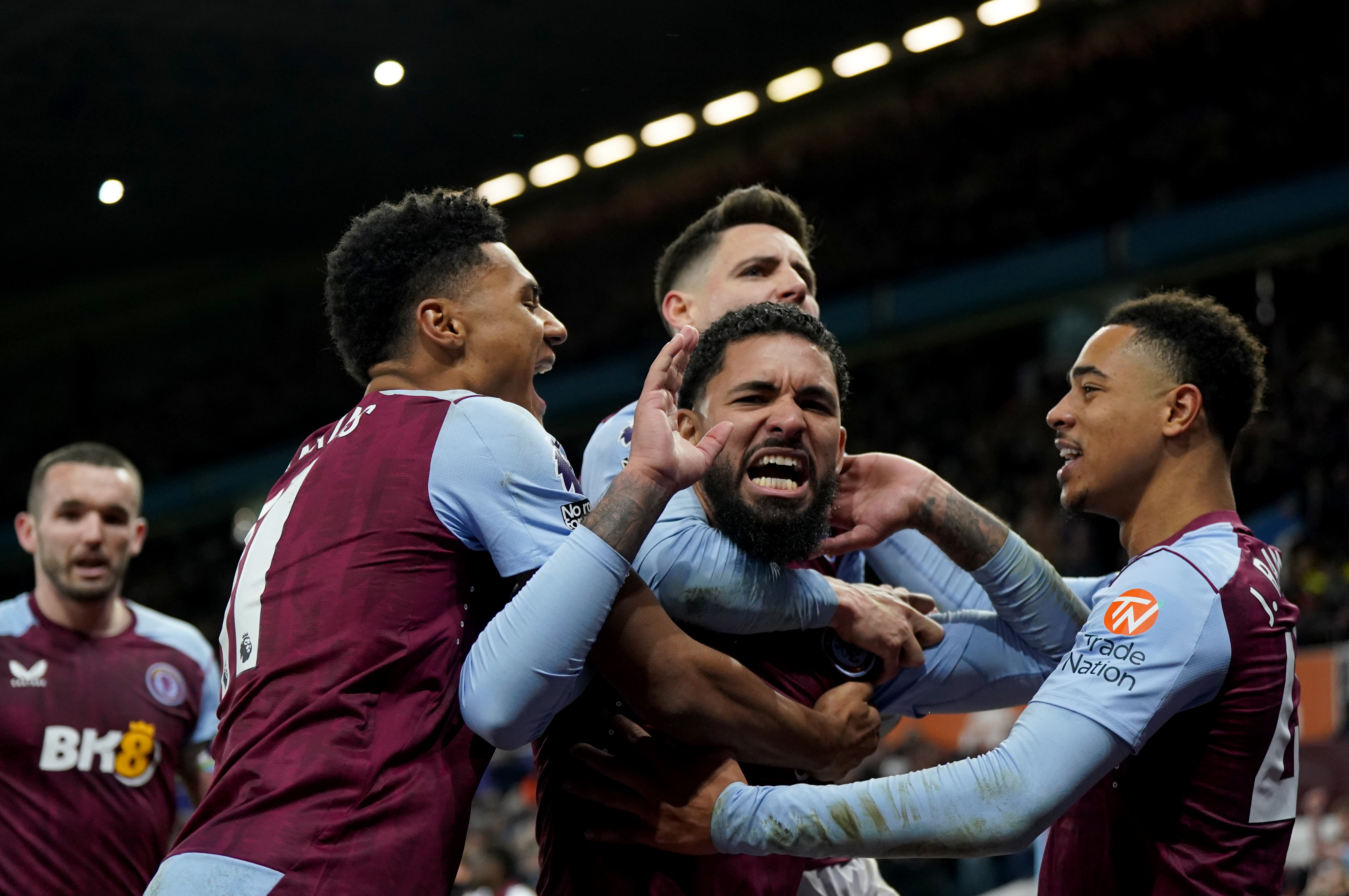 Douglas Luiz (centre) scored the winner from the spot