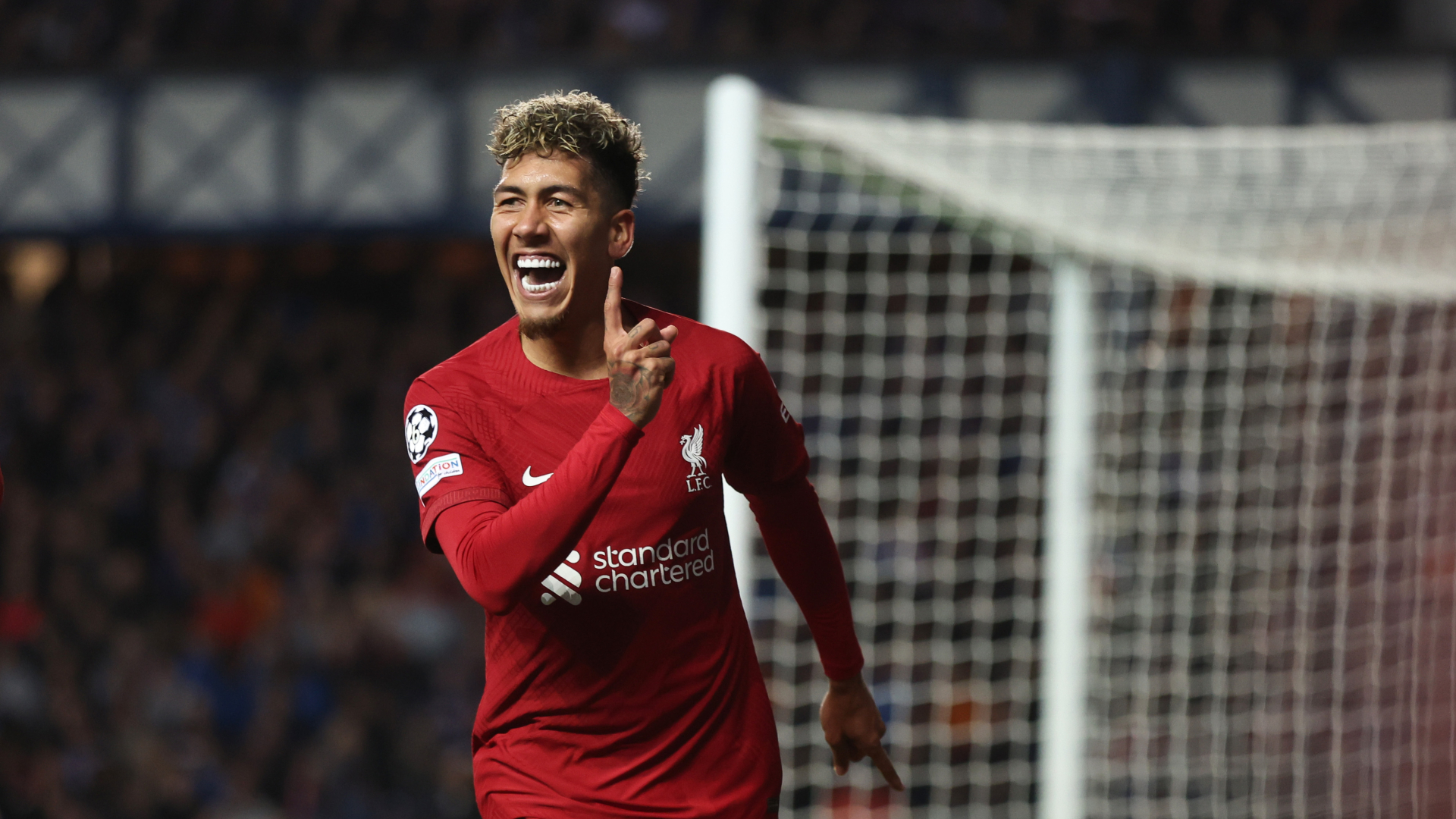 Roberto Firmino celebrates scoring for Liverpool against Rangers in the Champions League