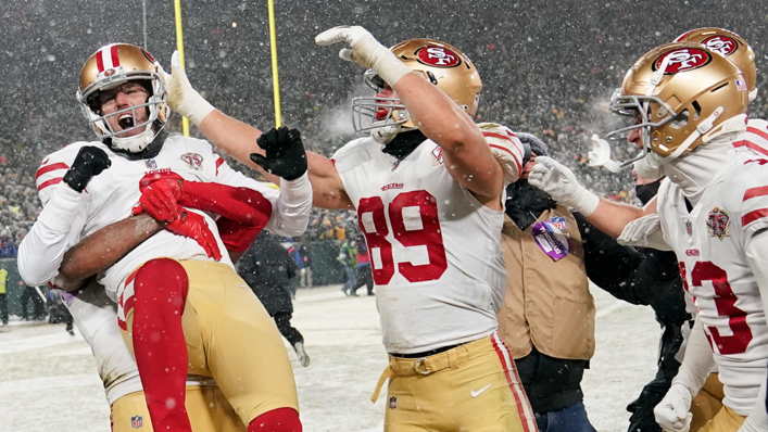 Kicker Robbie Gould of the San Francisco 49ers is congratulated by teammates after kicking the game-winning field goal to win the NFC Divisional Playoff game